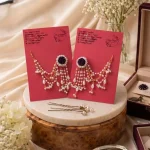 Dark rose and pearl necklace paired with matching dangling pearl earrings