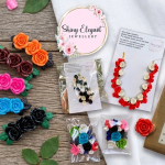 Dark rose and pearl necklace paired with matching dangling pearl earrings